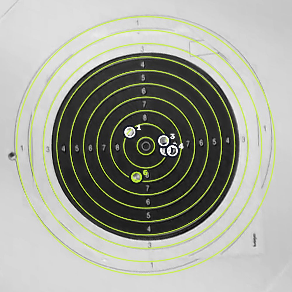 The target straightened, its rings found, five hits numbered